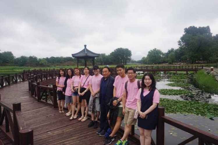 In front of a lake in Yuanmingyuan.